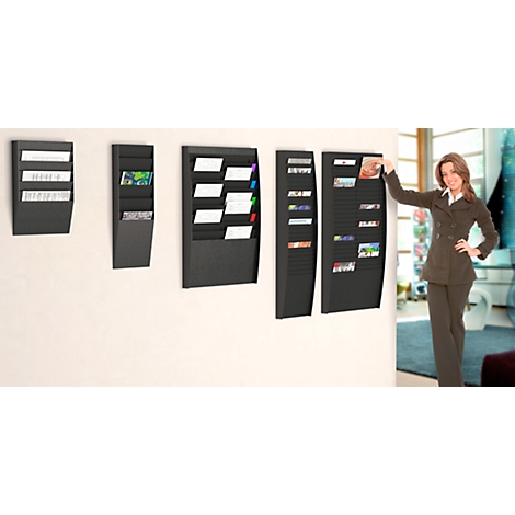 Three black wall holders with a woman in a suit in an office. One holder is being touched by the woman.