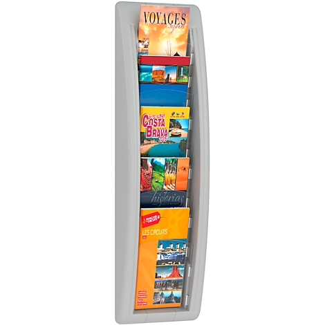 Gray wall-mounted brochure holder with travel brochures. The holder has several compartments. Brochures with titles like "Voyages" and "Costa Brava".