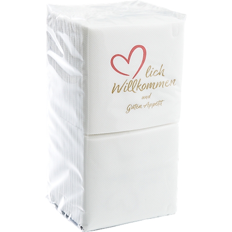 Serviettenpaket, weiß, mit rotem Herz und Schriftzug: Herzlich Willkommen und Guten Appetit.