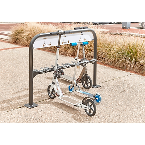 Two e-scooters in a rack. The left one is white with blue accents, the right one is brown.