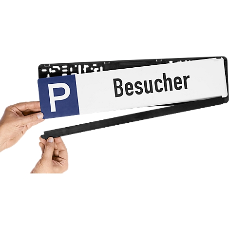 Person holding a license plate with "Besucher" and the blue "P" symbol. Black frame.