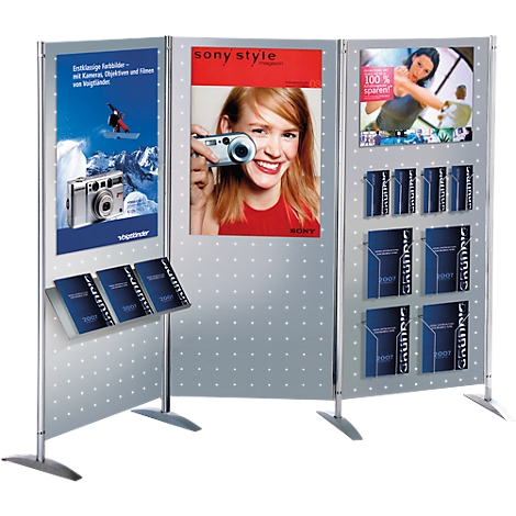 Display with advertising and brochures. One display shows a woman with a camera. Several holders with brochures.