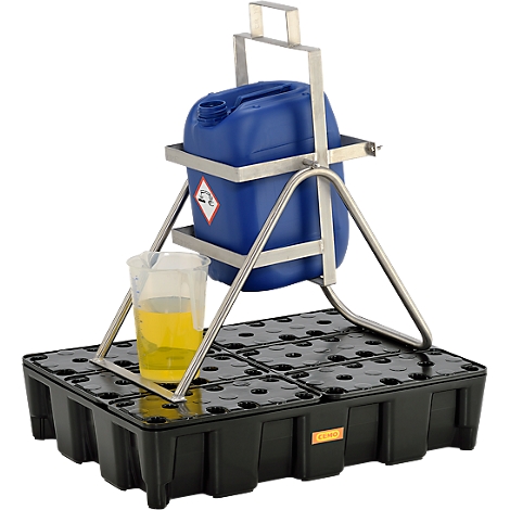 Blue canister with hazardous material symbol in holder, over yellow liquid in a beaker on a black spill containment pallet.