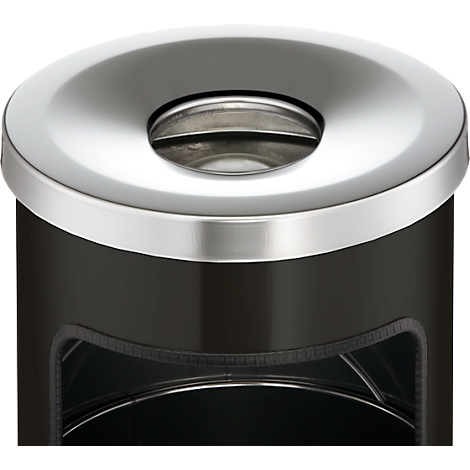 Close-up of a black trash can with a metal edge and opening.