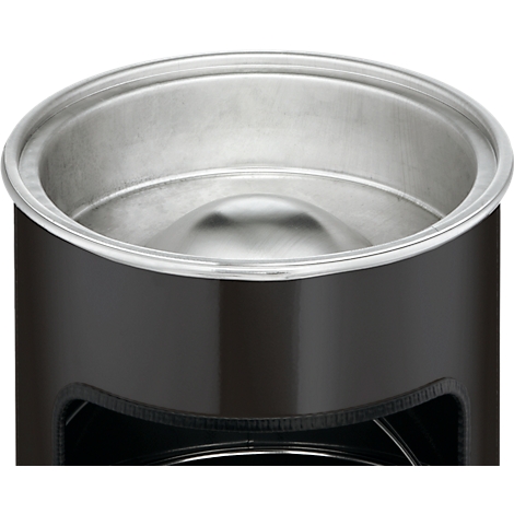Close-up of a black container with a silver interior and rim.