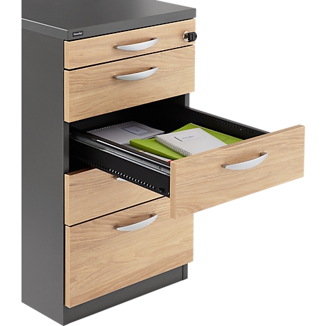 Chest of drawers with open drawer holding documents. Wood look with silver handles, black frame.