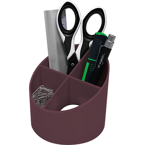 A burgundy desk organizer holding scissors, pens, paperclips, and a piece of paper.