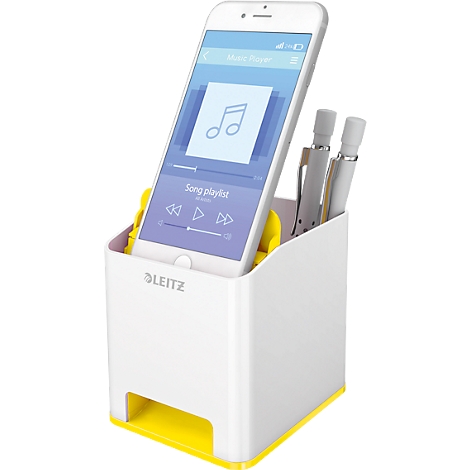 White desk organizer with yellow accents, a smartphone showing a music app, and pens.