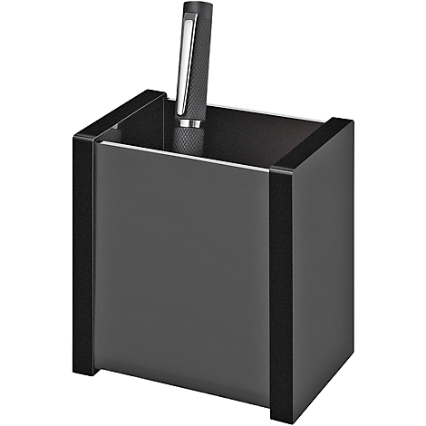 Black pen holder with a silver pen partially inserted. The holder has dark, rough accents.