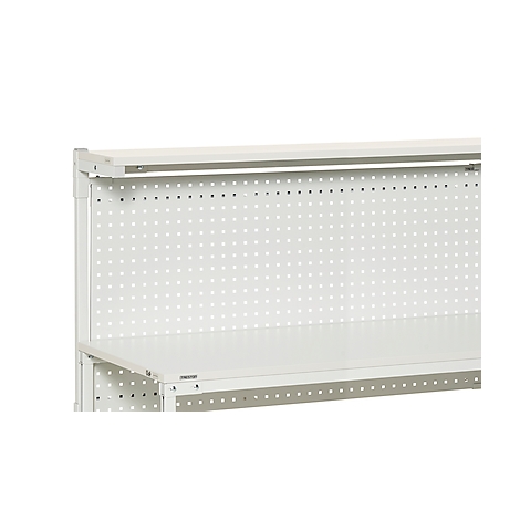 Close-up of a white workbench system. Numerous holes are visible on the back panel.