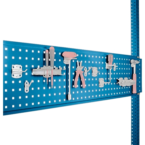 Blue perforated plate with tools: screw clamps, pliers, screwdrivers and hammer.