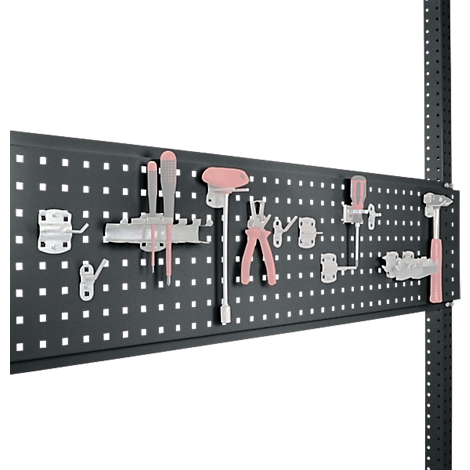 A pegboard with tools: screwdrivers, pliers and hammers in pink and grey.