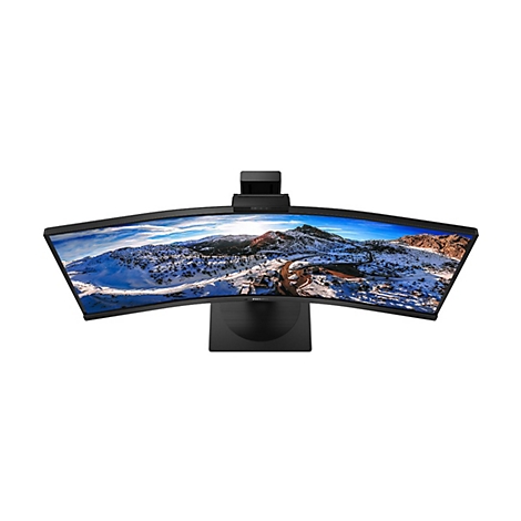 Ein schwarzer, gebogener Monitor mit Webcam, zeigt eine Landschaft mit Bergen, Schnee und Himmel.