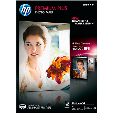 Photo paper packaging with a bride on the cover. Inscription: Premium Plus, Instant Dry, Water Resistant.