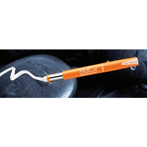 An orange Pica-Gel signal marker on black pebbles. The white color of the pen is shown on the stone.