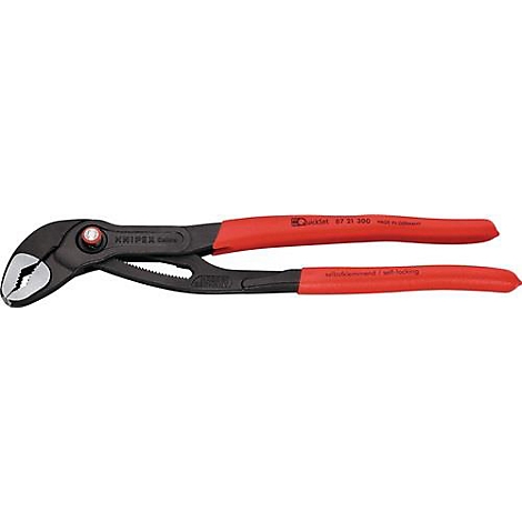 Pince Knipex, noire avec poignées rouges. Inscription : Knipex. Outil.