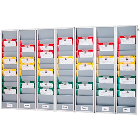 Gray wall chart with colored card holders. Red, yellow, and green cards.