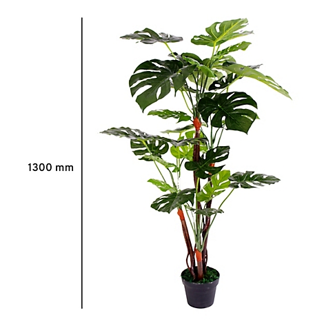 Plante artificielle Monstera dans un pot noir. Feuilles vertes, tiges brun-rouge. Hauteur : 1300 mm.