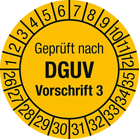 Autocollant jaune avec des chiffres, inscription 'Geprüft nach DGUV Vorschrift 3'.