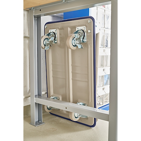 A beige trolley attached to a metal structure. The detail shows the wheels.