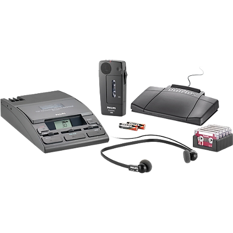 Various devices for dictation recording, including a recorder, a charger, headphones, batteries, and cassettes.