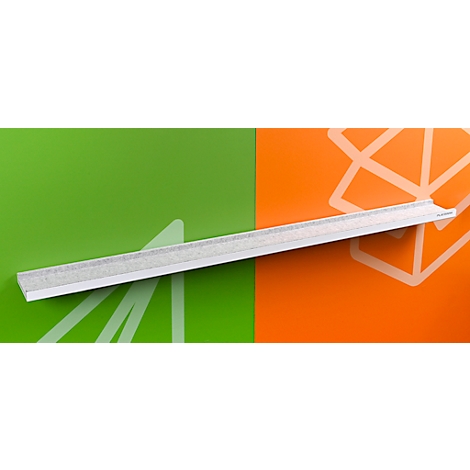 Règle blanche en diagonale devant un fond vert-orange. Des unités de mesure sont reconnaissables sur la règle.