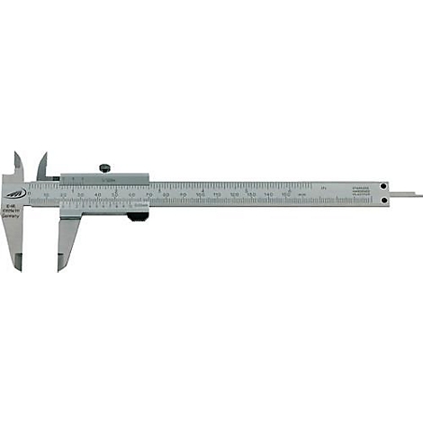 A gray caliper, with scale and fine measuring tips, lies on a white surface.