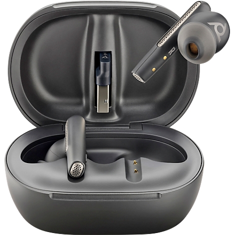 Dark grey earbuds with charging case. One earbud is in the case, one is being taken out. There is a USB connector in the case.