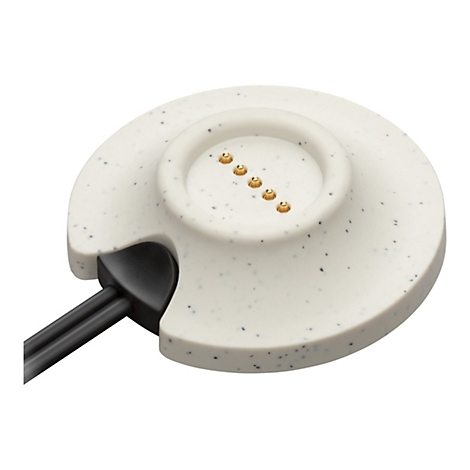 Hellgraue Ladeschale mit schwarzen Punkten, darauf goldfarbene Kontakte. Schwarzes Kabel.