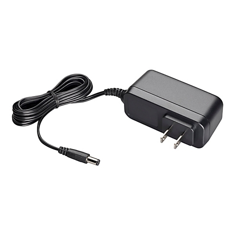 Ein schwarzes Netzteil mit einem Netzkabel, einem DC-Anschluss und einem zweipoligen Netzstecker. Das Kabel ist zum besseren Transport zusammengebunden.