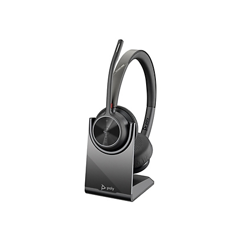 Ein graues Headset mit Ladeschale, auf weißem Grund. Auf dem Hörer steht "Voyager 4320".