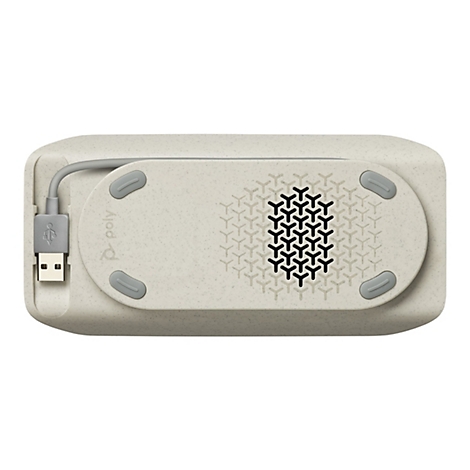 Draufsicht auf ein beiges, rechteckiges Gerät mit abgerundeten Ecken. Es hat eine ovale, perforierte Oberfläche und drei graue Pads. Ein USB-Kabel ist eingesteckt.