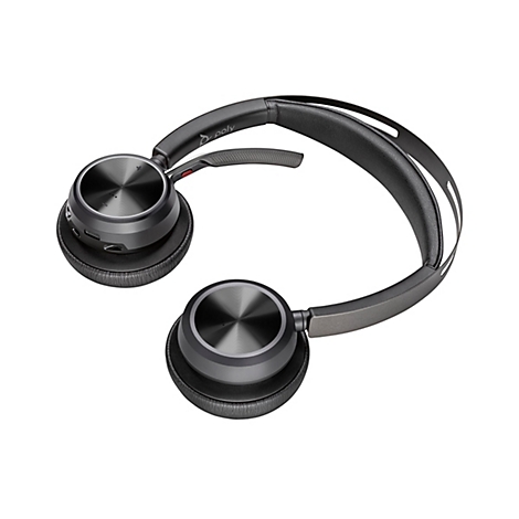Draufsicht auf ein drahtloses schwarzes Headset. Das Headset liegt vor weißem Hintergrund. Der Kopfbügel ist grau, das Polster schwarz.