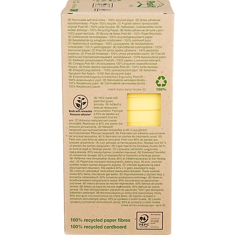 Close-up van een productverpakking van gerecycled papier, met tekst en een gele notitieblokstrook.