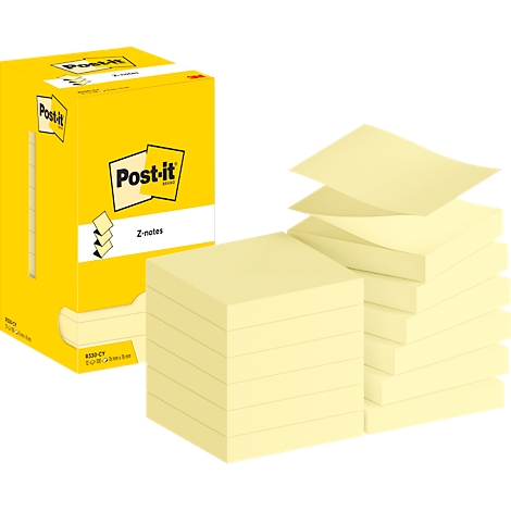 Post-it jaunes, certains en vrac, d'autres en piles. En arrière-plan, une boîte jaune avec le logo et le lettrage Post-it.