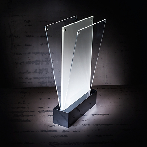 Sculpture with transparent elements and dark base. Looks modern and minimalist.