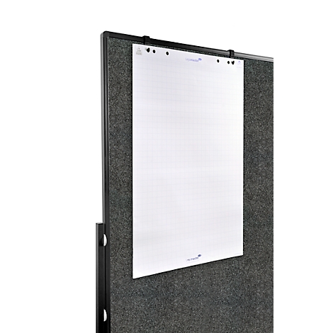 White paper on dark wall. Black frame. Blue details visible on the paper.