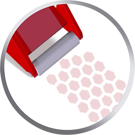 Red stamp rolling over honeycomb pattern. The stamp head is visible at the top right of the image.
