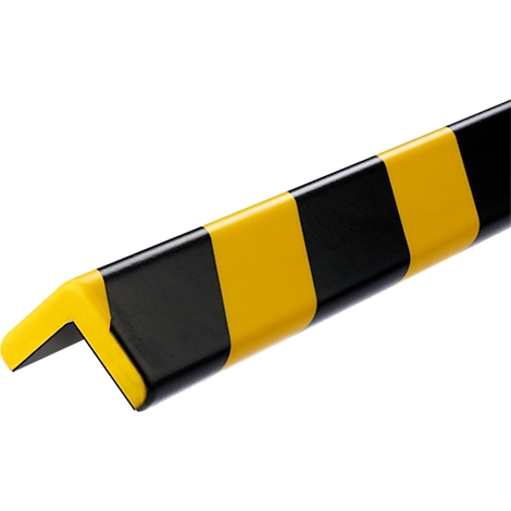Protection d'angle jaune et noir, rayée en diagonale.