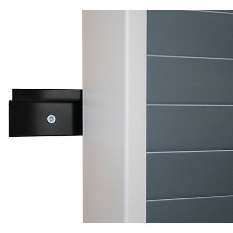Black metal holder screwed to white post. Gray slatted wall in the background.