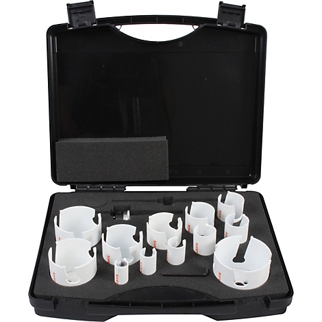 Mallette à outils noire avec diverses scies cloches blanches. L'étui est ouvert et doublé de mousse.