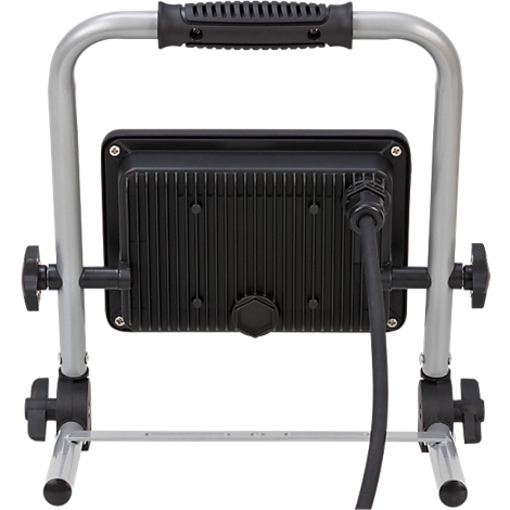 Vue arrière d'un projecteur de chantier portable avec un boîtier noir sur un cadre en métal argenté et un câble.