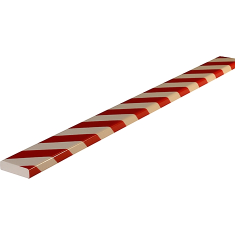 Un caramelo plano y oblongo con rayas rojas y blancas.