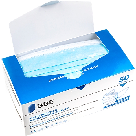 Une boîte de masques médicaux bleus, partiellement ouverte. La boîte contient des informations telles que "Protection médicale bouche-nez".