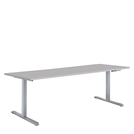 Un escritorio rectangular gris con dos patas metálicas en forma de T sobre un fondo blanco.