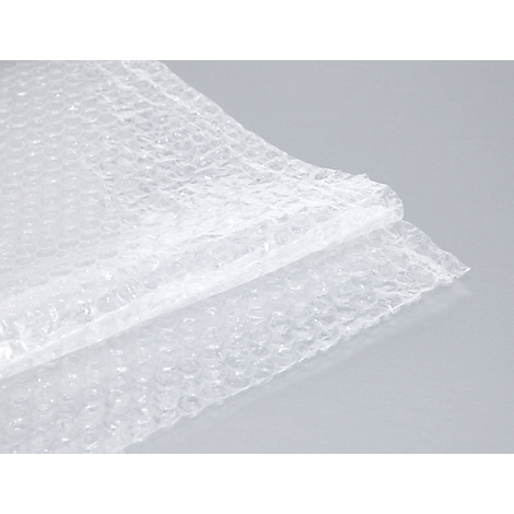 Close-up of bubble wrap, partially overlapping. Smooth and transparent.