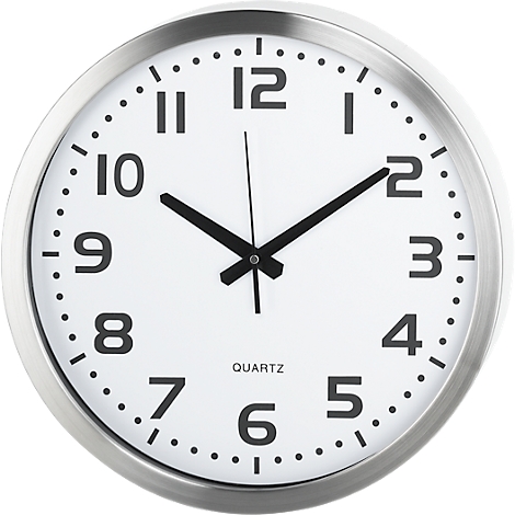 A silver wall clock with a black dial. The hands are pointing to 10:10. "QUARTZ" is written on the dial.