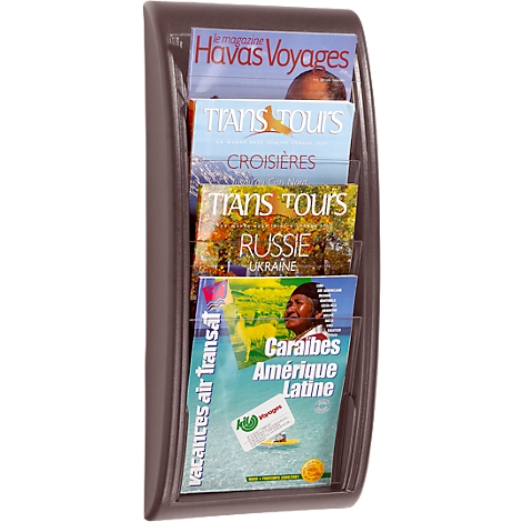 Brown magazine holder with travel magazines. Titles: Havas Voyages, Trans Tours, Russie, and Caribbean.