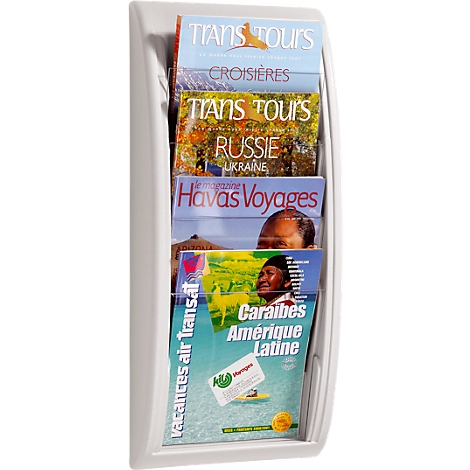 A white brochure holder filled with travel brochures, including 'Trans Tours' and 'Havas Voyages'.
