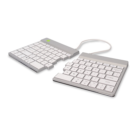 Clavier divisé, argenté avec touches blanches et étiquettes de touches. Connecté par un câble.